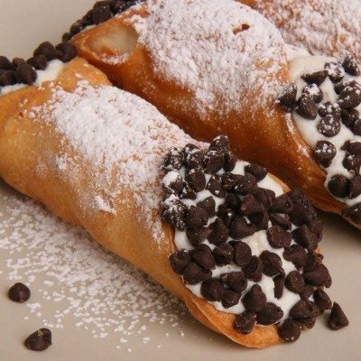 Fresh Filled Cannoli. Plain or Chocolate Iced.